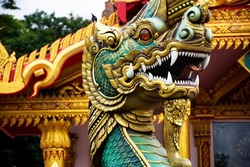 Ancient art of naga or antique naka statue of Wat Phra Kaew temple for thai people travelers travel visit and respect praying and blessing holy mystery worship at Chainat city in Chai Nat, Thailand
