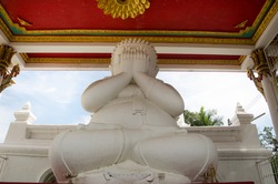 White fat buddha statue hand blind eye or see no evil buddhas statues for people praying and visit at  Wat Pa Mok Worawihan temple in Ang Thong, Thailand