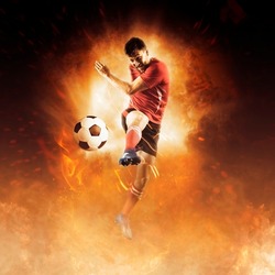 Soccer player in action on fire background