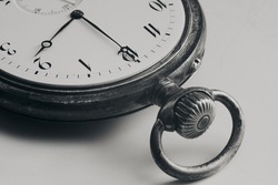 Close Up silver old pocket watch. Vintage timepiece. Antique concept. Black and white images.
