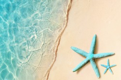 Starfish on the summer beach. Summer background. Tropical sand beach.