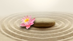 Zen garden meditation stone background and flower with stone and lines in sand for relaxation balance and harmony spirituality or spa wellness.