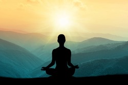  Yoga and meditation. Silhouette.