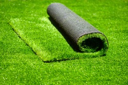 artificial rolled green grass; closeup