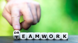 Dice form the words teamwork and dream work.