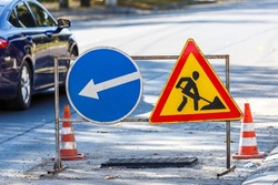 Road signs!Road works with trucks and traffic signs.road works road blocked signs and traffic cones diversion access only;Barriers and road signs.