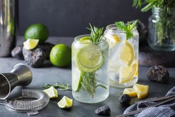 Hard seltzer cocktails with lime and lemon and bartenders accessories