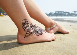 Henna tattoo on the foot. Palolem beach of South Goa, India