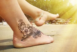 Henna tattoo on the foot. Palolem beach of South Goa, India