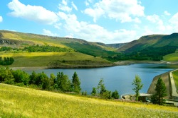 Dovestone Reservoir lies at the convergence of the valleys of the Greenfield and Chew Brooks above the village of Greenfield, on Saddleworth Moor in Greater Manchester