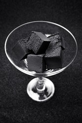 Coal for hookah. Coal for a hookah on a gray background.
