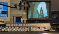 Professional condenser microphone in TV production studio interior