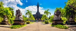 Panoramic landscape traditional balinese hindu temple Bajra Sandhi monument in Denpasar, Bali, Indonesia on background tropical nature and blue summer sky, Indoneisia