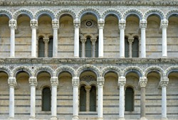 The stone columned galleries of the West facade of Pisa Cathedral  (Catedral de Pisa), Italy