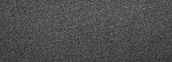 Dark gray denim background.The texture of black fluted denim.Background of black jeans.