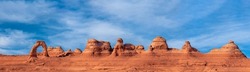 delicate arch in Arches National Park with clouds