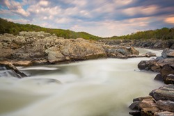 Long exposure of rapids in the Potomac River at sunset, at Great Falls Park, Virginia.
