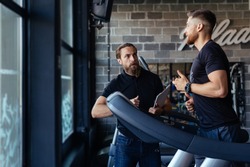 Personal training with a trainer on a treadmill. 