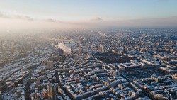 Panoramic aerial view of winter city Kyiv covered in snow