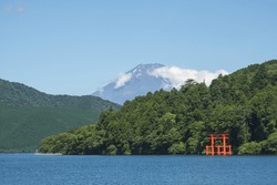 Torii gate in Japanese temple gate at Hakone Shrine with Fuji mountain background near lake Ashi at Hakone city, Kanagawa prefecture, Japan
