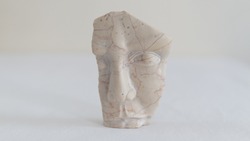 miniature marble human face sculpture