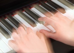 nimble hands playing the piano                               