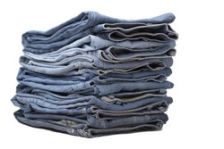 the heap of modern designer blue jeans