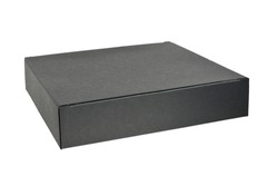 Paper cardboard gift box in black color on white background, close-up