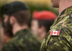 Flag of Canada on the military uniform. Canadian soldiers. Army of Canada. Remembrance Day. Canada Day. 