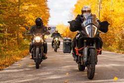 Group of friends riding motorcycles in the fall in Canada
