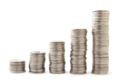 Five stacks of coins with growth between stacking limits on white background.