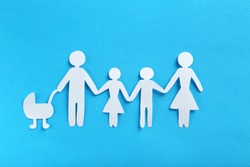 Happy paper family on blue background