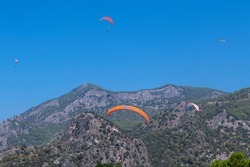 Paraglider fly from Mount Babadag in Fethiye, Turkey. Mount Babadag near Fethiye and a famous paragliding area in Turkey.
