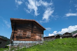 Highland houses made of stone and wood. Wooden highland houses built on the hill. Historical highland houses. Hazindak Highland Rize.
 Wooden plateau houses in Turkey. Hazindak Plateau Rize Türkiye.