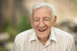 Happy smiling 90 year old elder senior man portrait