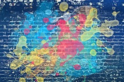 Paint splash on brick wall