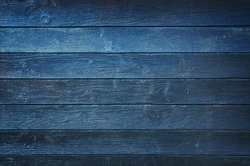 Vintage wooden dark blue horizontal boards. Front view with copy space. Background for design.