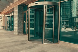 Curved doorway to the office, bank, corporation. Glass and metal doors