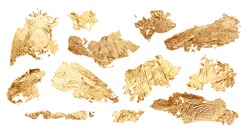 Gold glitter and bronze color blot. Abstract torn piece of metal leaf (potal) paper on white background. Collection.