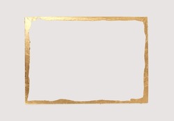 Gold (bronze) glitter empty frame on beige gray paper background. Abstract copy space texture.