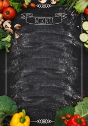 Design concept for restaurant menu mockup. Black rustic chalkboard with white inscription and vegetables frame, top view, copy space for text and logo, vegetarian cafe concept