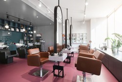 Workplace makeup artist and hairdresser. Nobody. Big mirrors and leather chairs, beauty salon interior