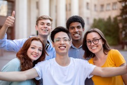 Cheerful Multicultural Students Posing Together Making Selfie Near University Building Outdoors. College Education Concept