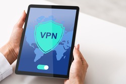 VPN Virtual Private Network App Opened On Digital Tablet In Female Hands. Unrecognizable Lady Using Modern Technologies For Personal Data Security And Protection, Creative Collage, Closeup