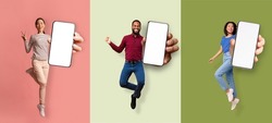 Happy excited asian women and african american man jumping from joy and showing phone with empty screen, isolated on colored background. Virtual advertising, great offer and good website, collage
