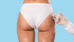 Non-Sugical Butt Lifting Sculptra Concept. Rear back view of young lady getting hip injection at beauty salon, closeup cropped. Surgeon making injection at buttocks area, isolated on studio background