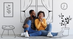 Black guy and his excited girlfriend imagining their new furnished home sitting on floor against white wall background with interior drawings doodle, day dreaming about new house renovation, banner