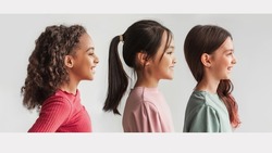 Collage Of Profile Portraits With Multiethnic Preteen Girls Looking Aside Posing Over White Background In Studio. Side View Headshots Of Three Happy Kids. Panorama