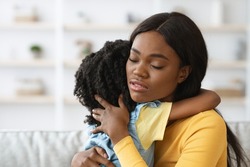 Caring African American Woman Hugging Little Daughter, Comforting Her Upset Child, Closeup Shot Of Loving Black Mother Embracing Female Kid At Home, Loving Mommy Soothing Crying Girl, Free Space