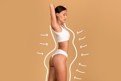 Liposuction concept. Drawn outlines with arrows around fit lady in white underwear, slender woman with perfect figure posing over beige studio background, collage